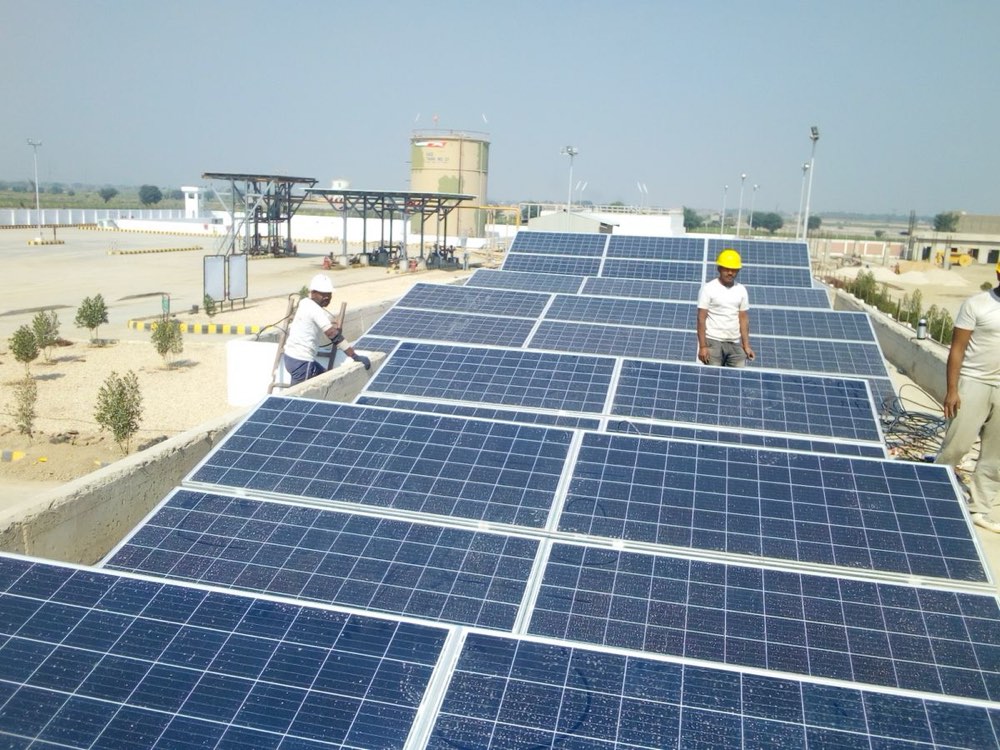 Solar technicians installing rooftop panels